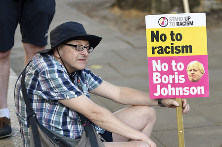 Anti Boris Johnson protester holds a placard during the rally.
Protesters gathered outside Downing Street to protest against the announcement of Tory Boris Johnson as a new UK Prime Minister, who was elected only by less than 150,000 members of the Conservative party, a party that doesn’t hold a majority in Parliament. They demanding an immediate general election and launched plans to protest at the Conservative party national conference later this year.