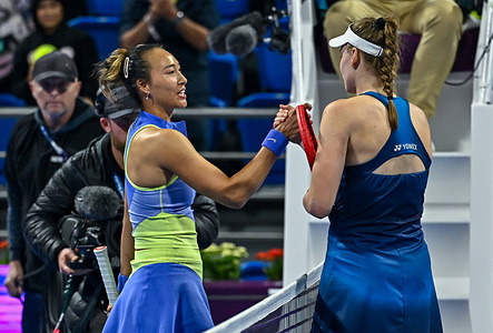 Elena Rybakina (R) of Kazakhstan shakes hands with Qinwen Zheng of China during their round of 16 match at the WTA Qatar Total Energies Open 2026 tennis tournament at the Khalifa International Tennis Complex. Elena Rybakina] won against Qinwen Zheng 4-6, 6-2, 7-5. 