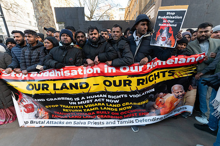 Protesters hold a banner saying "Our land, our rights" during the demonstration. Tamil protesters gathered outside Downing Street in London to oppose what they described as the Buddhisation of Sri Lanka, condemning land grabbing and the construction of Buddhist sites such as Thayitti Vihara on traditionally Tamil land. Demonstrators called for international scrutiny, protection of minority and religious rights, and accountability for policies they say marginalise Tamil communities.
