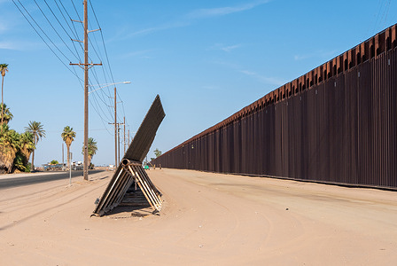 The border wall separating Calexico, California from Mexicali, Mexico is seen. On August 21, 2008, a federal judge ruled that no new prisoners could be sent to the center and much of the facility would need to be dismantled within 60 days after finding that the government did not conduct environmental assessments before building.