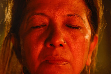 A mourner is seen at a candlelight vigil for the 71 people killed during the Gen Z protests in Lalitpur. The protests Gen Z were triggered by a nationwide ban on numerous social media platforms, and were linked to popular frustration with corruption and displays of wealth by government officials and their families.