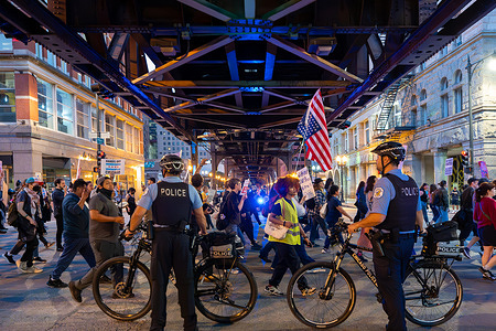 Chicagoans march under the El tracks on Wells Street during the demonstration President Trump has repeatedly threatened to deploy the National Guard to Chicago, as he has done in Los Angeles and Washington this summer. The increased immigration enforcement may be an initial step before the military is sent into the city.