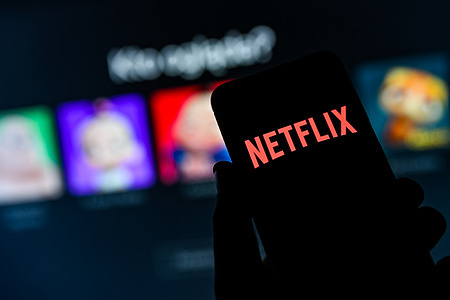 In this photo illustration a Netflix logo seen displayed on a smartphone.