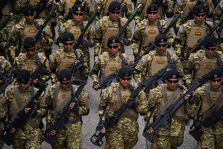 Soldiers take part in a military parade to celebrate El Salvador's 204th Independence Day.