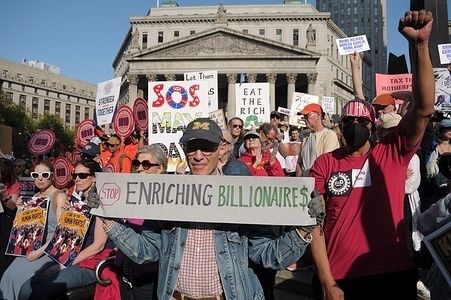 May Day pro-worker demonstrators hold placards in Foley Square. Demonstrators in Manhattan, New York City rallied in support of workers on May Day or International Workers' Day. Protesters demanded housing and healthcare for all families, fair wages, worker safety and protection of unions. Additionally, demonstrators supported the working class and criticized the deportation of immigrants by the Trump administration. Furthermore, protesters denounced Trump for policies they claim fuel corporate greed and favor an oligarchy of billionaires. Protesters also criticized Tesla’s CEO, Elon Musk, and his Department of Government Efficiency, DOGE, for firing federal employees and cutting federal services.