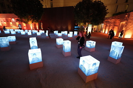 A view of the opening of the “241” exhibition, featuring 241 illuminated boxes displays photos of Palestinian children killed in Israeli attacks on Gaza. The exhibition was organized by Qatar Charity in collaboration with Msheireb Museums.