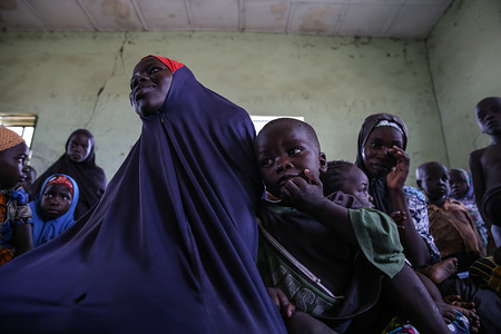 Displaced people sit in an IDP camp in Gwoza, the former headquarters of Boko Haram's short-lived caliphate.