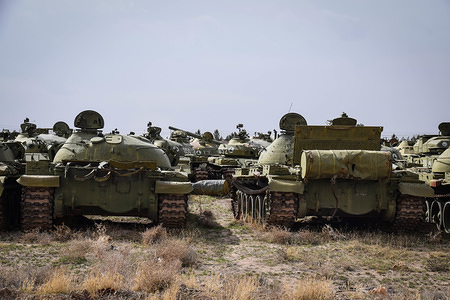 "Cemetery" of old Soviet tanks, Herat Military Airport, Guzara district, Herat province. 
While the focus nowadays lies often on the U.S. involvement in the Afghan war that began in 2001, the current Afghan conflict rages on since much longer. The first chapter started with the Soviet invasion in 1979. And there are still rows of old Soviet tanks in Afghanistan that bear witness of this, as seen in these pictures from the western province of Herat.