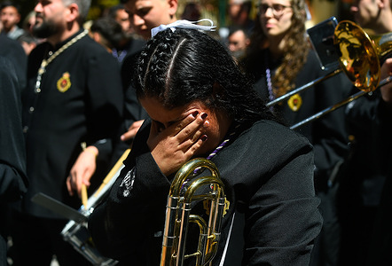 A musician from "Rocio" brotherhood is seen crying as she takes part in a procession on Holy Tuesday to mark the Holy Week celebrations. Thousands of worshippers wait to see the processions with the statues of Christ and the Virgin Mary as part of the traditional Holy Week celebrations. In Andalusia, Easter brings together thousands of people from all over the world and it's considered one of the most important religious and cultural events of the year.