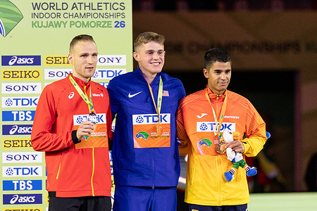 Eliottm Crestan of Belgium (L), Cooper Lutkenhausof USA (C) and Mohamed Attaoui of Spain hold their medals during the WORLD ATHLETISC 2026: 800 Meters Men (Final) at Arena Torun.