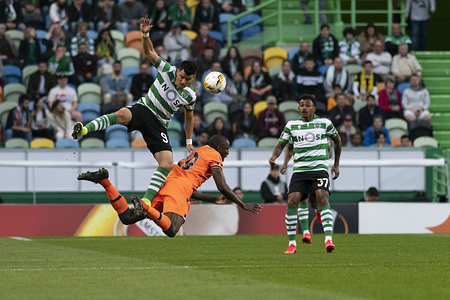 Sporting CP player Marcos Acuña (L) and Istanbul Başakşehir FK player Demba Ba (C) are seen in action during the UEFA Europa League Match 2019/20, Sporting CP vs Istanbul Başakşehir FK at José Alvalade Stadium.
(Final Score: Sporting CP 3 -1 Istanbul Başakşehir FK)