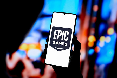 In this photo illustration, the Epic Games logo is displayed on a smartphone screen.