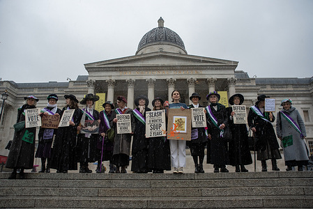 Climate activists stand with placards outside the National Gallery on the Trafalgar Square during the demonstration. Climate Activists dressed as suffragettes for International Women's day, stand on the steps of the National Gallery, to call out the row back in UK protest rights and demand the revoking of the public order act. Phoebe Plummer and Anna Holland from Just Stop Oil received a combined 3 years for damaging the frame of a Van Gogh painting with soup, whereas a suffragette, Mary Richardson received 6 months for slashing a Velázquez painting 7 times.