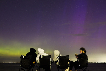 Families and friends are seen watching the southern lights at Werribee South Beach, Victoria. Werribee South Beach, Victoria, is among the locations where the southern lights may be visible as an aurora alert is issued, during one of the strongest solar storms in more than 20 years. The aurora australis could also be seen from other parts of southern Australia, including Tasmania, southern South Australia, and southern Western Australia, with reports suggesting increased geomagnetic activity may bring the lights farther north than usual.