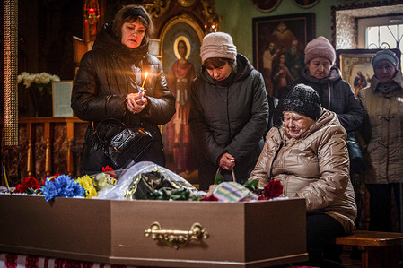 EDITOR S' NOTE: IMAGES DEPICT DEATH Relatives of the fallen Ukrainian soldier bid their final farewell during the funeral ceremony. St. George's Church hosted the funeral of a Ukrainian soldier who died in service during the war. The family mourned his death in a ceremony inside the church with friends and fellow soldiers.