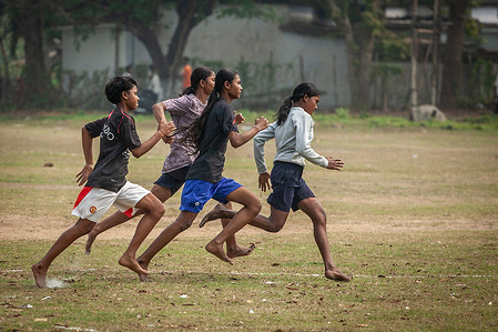 Girls from rural and tribal communities seen running on the track. To mark International Women’s day, girls and women from rural and tribal communities compete in a nationwide athletics league under the ASMITA (Achieving Sports Milestone by Inspiring Women through Action) initiative. The district-level event supported by the East Singhbhum District Sports Association provides a grassroots platform for amateur female athletes of all ages to showcase their talent in track events.
