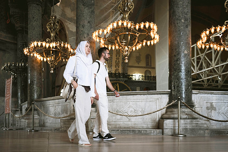 A couple seen walking inside Aya Sofya