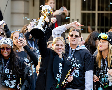 NJ/NY Gotham FC's Taryn Torres (8) holds up the NWSL Championship trophy following a ceremony presenting the team with the Key to the City at City Hall, Monday, Nov. 24, 2025, in New York. NJ/NY Gotham FC celebrates its NWSL Championship during a Champions Parade along Broadway’s Canyon of Heroes and at City Hall Park, where the team received a key to the city from Mayor Eric Adams on November 24, 2025, in New York City.