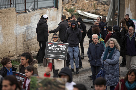 A protester holds a placard saying "Palestinian lives matters" during the demonstration. Israeli left-wing peace activists and Palestinians take part in a demonstration against evictions from homes in the Israeli-annexed east Jerusalem neighborhood of Sheikh Jarrah.