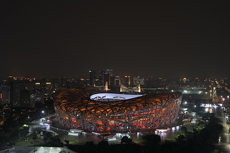 The Beijing National Stadium, popularly known as the Bird's Nest displays golden lighting during the night.
The stadium was designed by Swiss architecture firm Herzog & de Meuron in collaboration with Chinese artist Ai Weiwei and served as the centerpiece of the 2008 Summer Olympics and 2022 Winter Olympics.
