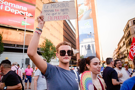 A protester holds a placard during a demonstration against racism and xenophobia at Plaza del Callao in central Madrid. To denounce the actions such as “hunting” migrants, violent street confrontations, attacks on homes and businesses of Maghrebi residents, that occurred in the town of Torre Pacheco, Murcia.