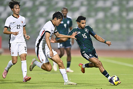 Abdulrazaq Awaji (R) of Saudi Arabia and Jim Ho Chun (C) of Hong Kong, China seen in action during the AFC U20 Asian Cup China 2027 Qualifiers match between Saudi Arabia and Hong Kong, China at Hamad Bin Khalifa Stadium. Final score; Saudi Arabia 2 : 0 Hong Kong, China.