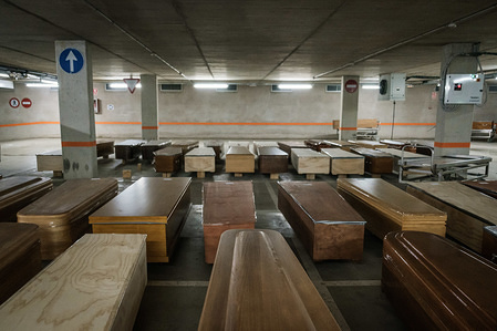Coffins full of dead bodies from Coronavirus (Covid-19) in the Collserola mortuary parking lot. This space has been converted into a morgue due to the increase in deaths of Covid19.

Coronavirus outbreak in Spain has already killed 14,659 people. The large number of deaths has forced Eurocoffin, the main coffin factory in Catalonia, to triple its production, from 50 to 150 coffins per day. Isolation and quarantine prevent family members from gettting infected or infect others. In Spain today, the pandemic leaves numbers of 146,690 infected and 48,021 recovered.