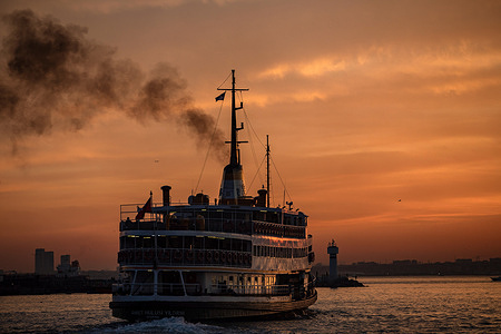 The city lines ferry was seen in motion, while beautiful colors were forming in the sky at sunset. As the sun sets in the evening hours in Istanbul, there was a visual feast in the sky from the Kadikoy dock.