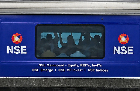 Passengers seen standing inside the metro train with a National Stock Exchange (NSE) branding on it. The National Stock Exchange (NSE) Initial Public Offer (IPO) was available for subscription to the public from 17th September 2026 and closed on 21st September 2026 with a price band of Rs.1700 (17.76 USD) to Rs.1,785 (18.65 USD). It will be listed on Bombay Stock Exchange (BSE) on 24th September 2026.