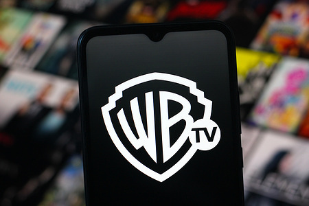 In this photo illustration, the Warner Channel logo is seen displayed on a smartphone screen.
