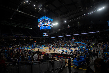 A panoramic view of the Movistar Arena's center court filled with stuffed animals thrown from the crowd during the fourth annual "Solidarity Shower of Stuffed Animals''. The event coincided with the Primera FEB (second tier of professional men's basketball in Spain) game between Movistar Estudiantes and Caja Rural CB Zamora. Attendees were able to exchange a new or gently used toy for a free ticket to the game. All the toys and stuffed animals collected were donated to the Madrina Foundation, which supports children, teenage mothers, and families at risk of social exclusion.