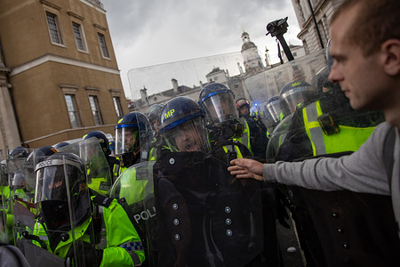 Members of the Metropolitan Police riot squad push back protestors. The Unite the Kingdom London March rally held on 13th September 2025 drew thousands of participants. This event was organised by political activist Stephen Yaxley-Lennon also known as Tommy Robinson who has previously led similar demonstrations focusing on issues of immigration and social integration. The timing of the rally coincides with ongoing national debates about border controls, community cohesion and the rise of radical Islam.
