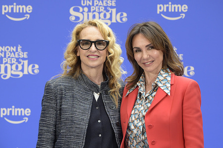Federica Lucisano (l) and Paola Lucisano (r) attend the photocall of movie Non è un paese per single at De La Ville Hotel Garden.