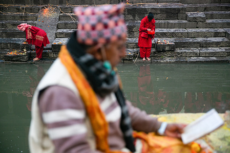 Hindu devotees offer prayers at Bagmati River during the Swasthani Brata Katha festival.
During this month-long festival, devotees recite Holy Scriptures dedicated to Hindu goddess Swasthani and Hindu God Lord Shiva. Unmarried women pray to get a good husband while those married pray for the longevity of their husbands by observing month long fast.