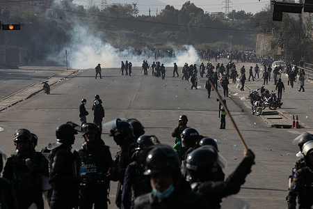 Clashes between Nepal Police personnel and pro-monarchy supporters during a demonstration against the Nepal's Federal Democratic Republic system at Balkhu. The supporters of pro-monarchy and businessman Durga Parsai demanded the return of Nepal's monarchy, and the clashes erupted as they made their way towards Maitighar, which had just been declared a prohibited zone. 
The police used tear gas and water cannons to control the situation.