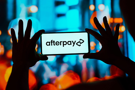 In this photo illustration, the Afterpay logo is displayed on a smartphone screen.