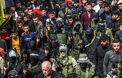 Masked Palestinian gunmen seen shooting in the air during the funeral of three Palestinians who were shot dead by the Israeli army, in the town of Jaba, near Jenin, in the occupied West Bank. Special Israeli forces from the undercover unit assassinated three Palestinians, at the entrance to the town of Jaba, The witnesses added that large forces of the Israeli army broke into the town and deployed snipers on rooftops of houses, noting that the special force infiltrated with a vehicle carrying a Palestinian registration plate.