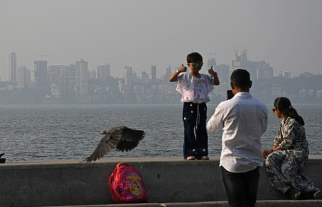 Buildings opposite the Marine Drive promenade are seen covered in smog during day time in Mumbai. Smog engulfs the city deteriorating the air quality during the winter season, dust from the ongoing construction work across various locations, smoke from vehicles, waste burning and industrial emission are the main source of air pollution. doctors have advised people not to exercise during early morning as it can lead to health issues especially to people with respiratory problems.