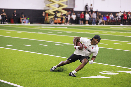 Indiana Hoosiers defensive back D'Angelo Ponds (5) catches a pass during NFL Pro Day. The Indiana Hoosiers held their NFL Pro Day, giving draft-eligible players the opportunity to showcase their skills in front of scouts, coaches, and executives from the National Football League. The event serves as a key step in the pre-draft process, allowing prospects to perform drills and position workouts to improve their chances ahead of the upcoming NFL Draft.