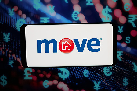 In this photo illustration, the logo of US real estate listing company Move Inc. is displayed on a smartphone in front of abstract background on computer screen.