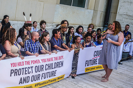 Activists carrying a huge banner protest on the sidelines of the Plastics Treaty negotiations at the United Nations, as talks on the worldís first plastic pollution treaty make little headway with the deadline fast approaching.