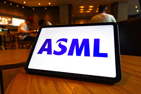In this photo illustration, the logo of ASML is displayed on the screen of the tablet.