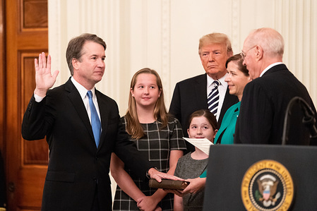 Former Supreme Justice Anthony Kennedy swearing in Brett Kavanaugh as an Associate Justice of the Supreme Court in the East Room of the White House.