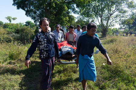 (EDITORS NOTE: Image depicts death) 
Villagers carry the body of a victim who died in a military airstrike for burial. The attack killed 18 people on the spot, injured more than 30 others—including several in critical condition—and damaged several houses.
