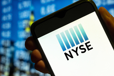 In this photo illustration, the American Stock Exchange index, NYSE logo is displayed on a smartphone screen.