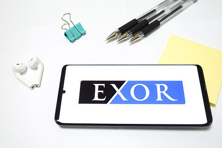 In this photo illustration, an Exor Group logo seen displayed on a smartphone screen.