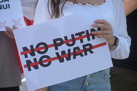 Supporter of Russian opposition leader Alexei Navalny seen holding a placard during the demonstration marking the third anniversary of his near-fatal poisoning. Alexei Navalny supporters demonstrated in 120 cities in 30 countries around the world under the slogan "Putin is a Killer."
