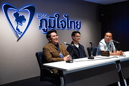Anutin Charnvirakul (R), prime ministerial candidate and leader of the Bhumjaithai party, speaks during the first meeting of the Bhumjaithai Party after winning the general election in Thailand.