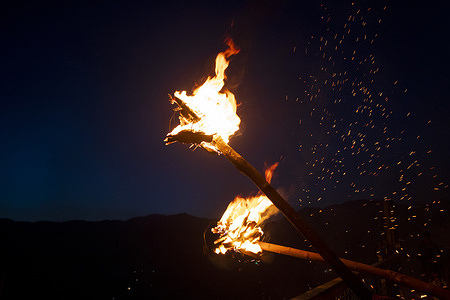 Kashmiri Muslims hold lit torches outside the cave shrine of Sakhi Zain-ud-din Wali, a Sufi saint, during an annual torch festival in Aishmuqam, 75 km (47 miles) south of Srinagar. Thousands of Muslim villagers in Indian-administered Kashmir gathered at a 15th-century Sufi saint's hilltop shrine for the annual torch festival, also known as the Zool Festival. Devotees lit wooden torches to honour the revered saint, marking the end of winter and the beginning of the paddy sowing season. Many believe this traditional torch festival commemorates the saint's victory over a demon that once terrorized local villagers. Flames illuminated the forested hillside as people paid obeisance at the mausoleum and took part in festivities that included traditional folk singing and musical performances.