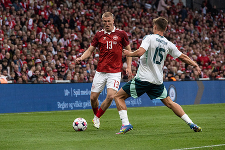 Rasmus Kristensen (L) of Denmark and Justin Devenny (R) of Northern Ireland in action during the friendly match between Denmark and Northern Ireland at Parken Stadium. Final score: Denmark 2 :1 Northern Ireland
